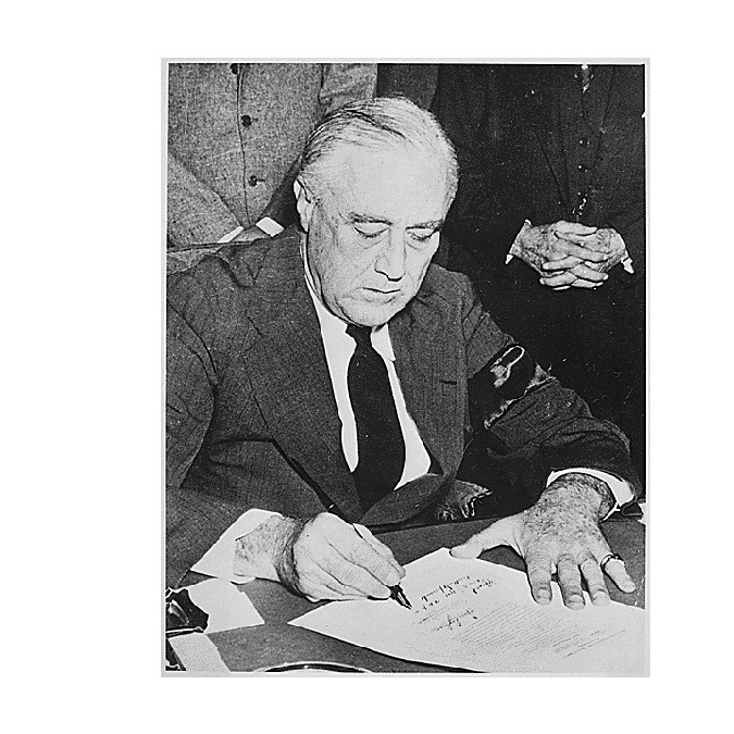 FDR signing declaration of war against Japan, December 8, 1941.
